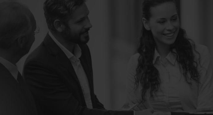 Network with Policymakers A smiling woman presenting data on a tablet to a colleague in a professional setting